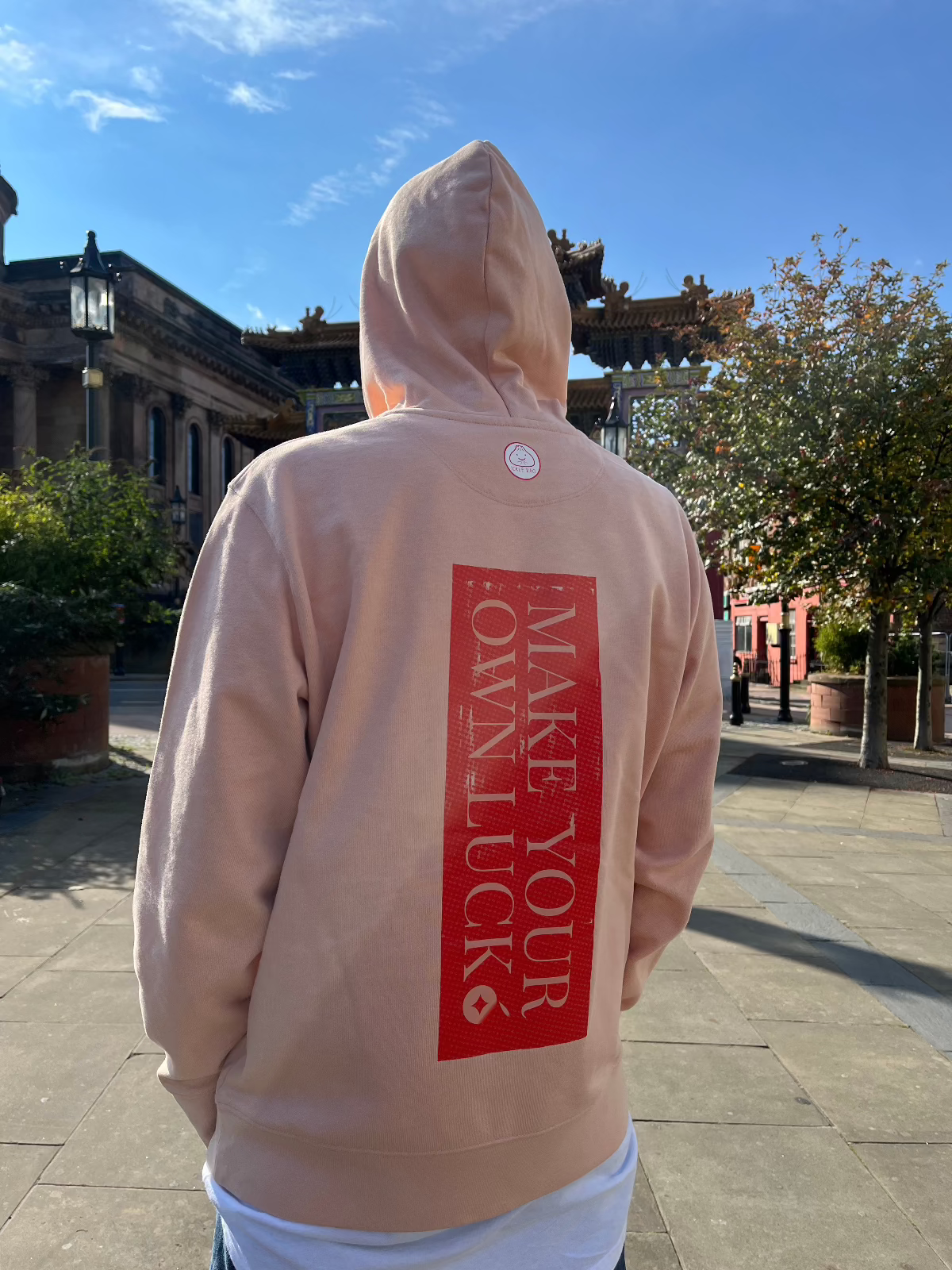 Reproducing the vibrant palette of the original artwork, this 350gsm Fresh Peach coloured 100% organic cotton adult hoody brings Niconico's lucky vibes into a beautiful wearable piece of art - a small Lucky Cabage on the front and a full back Make Your Own Luck red envelope print on the back help you to bring a huge helping of good luck with you wherever your feet will carry you!